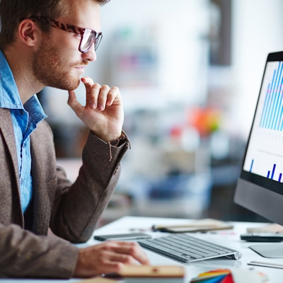 Business looking at data on computer